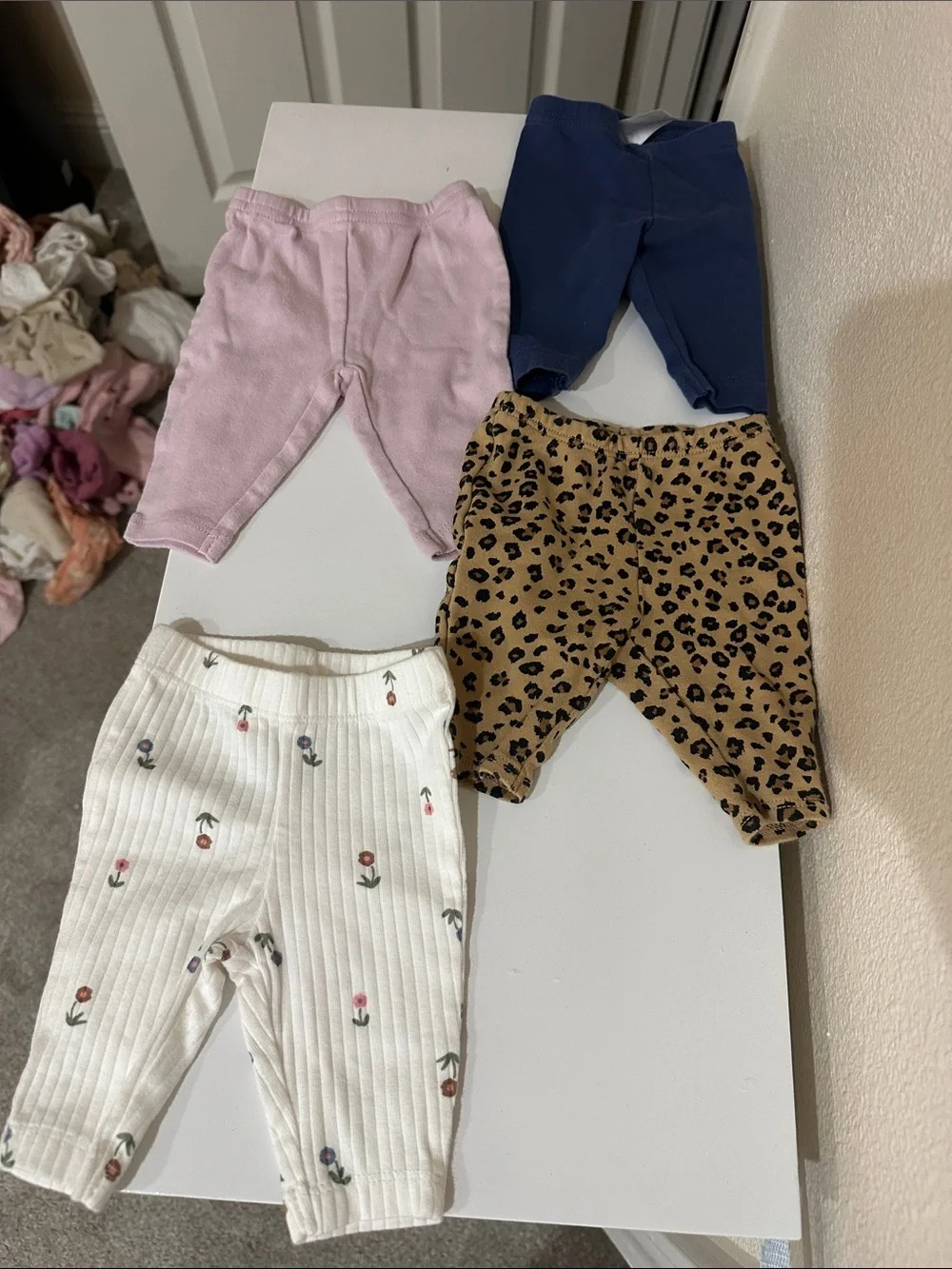 Carter's White Ribbed Newborn Pants with Small Multicolor Prints
